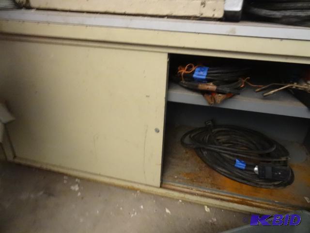 lot 18 image: Metal cabinet with sliding doors. 2 shelves. ...