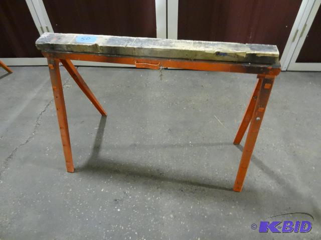 lot 50 image: Orange metal fold up saw horse. Extendable....