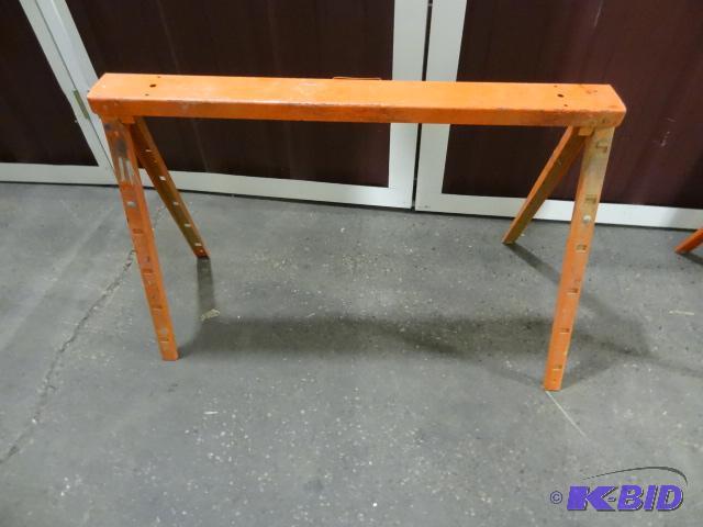 lot 51 image: Orange metal fold up saw horse. Extendable....