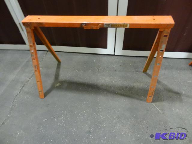lot 52 image: Orange metal fold up saw horse. Extendable....