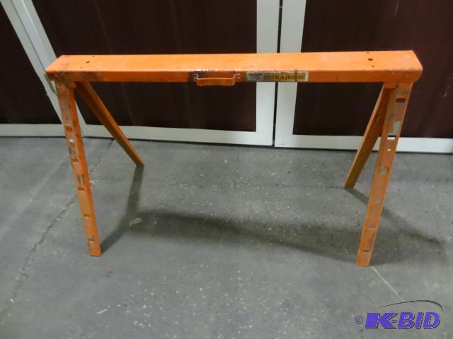lot 53 image: Orange metal fold up saw horse. Extendable....