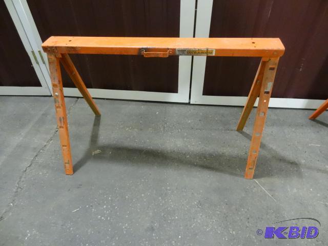lot 54 image: Orange metal fold up saw horse. Extendable....