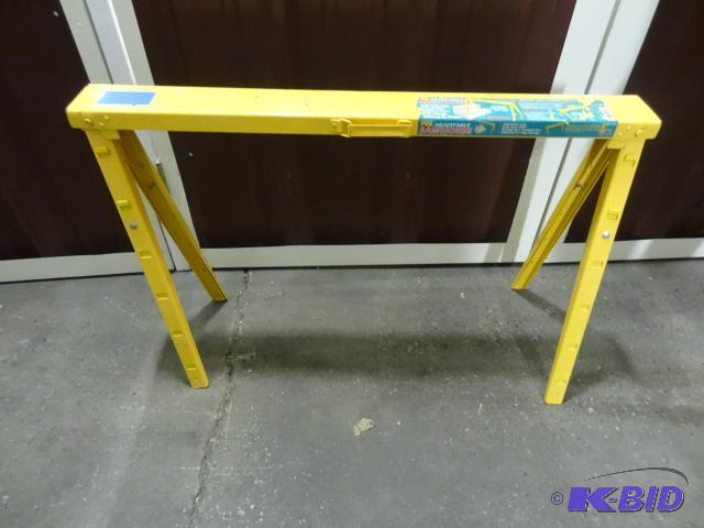 lot 55 image: Yellow metal fold up saw horse. Extendable...