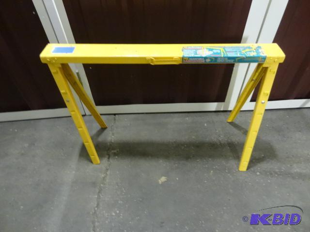 lot 58 image: Yellow metal fold up saw horse. Extendable...