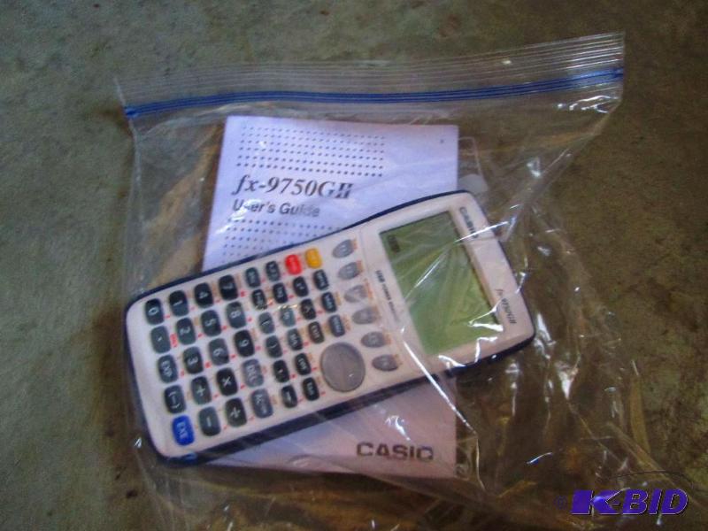 lot 157 image: Casio fx-9750GII scientific calculator...