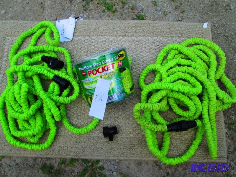 lot 26 image: Pair of pocket hoses, grows to 50 feet, as se...