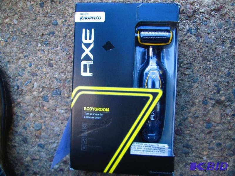 lot 37 image: Axe Norelco body groom trim or shave...