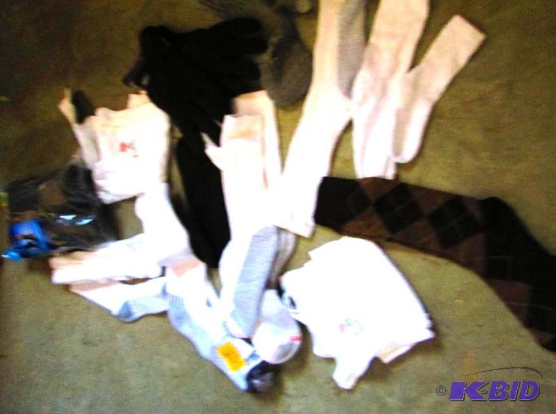 lot 93 image: mixed lot of mens socks, tanks, and a pair of...