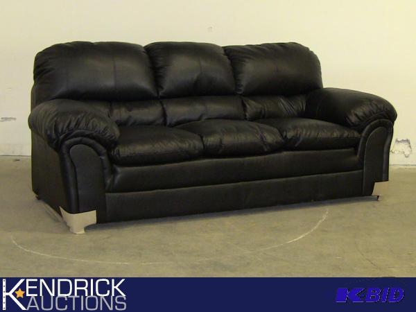 lot 24 image: New Commando Black DuraBlend Ashley Sofa