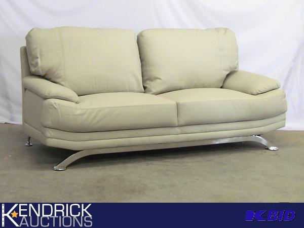 lot 28 image: NEW Contemporary Cream Faux Leather Sofa