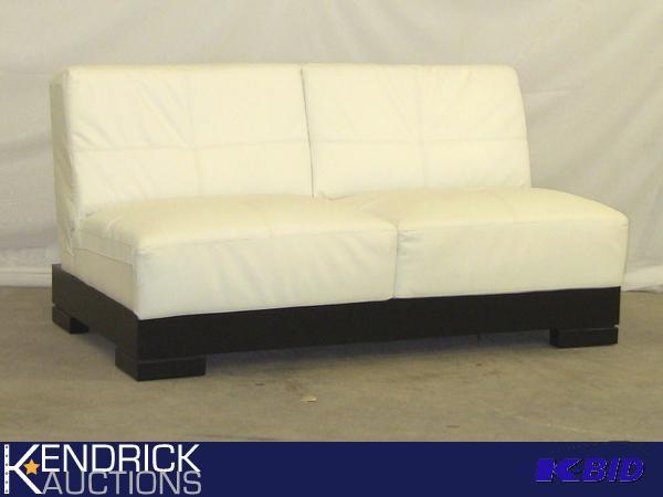 lot 29 image: New Modern White Faux Leather Loveseat with Black Base