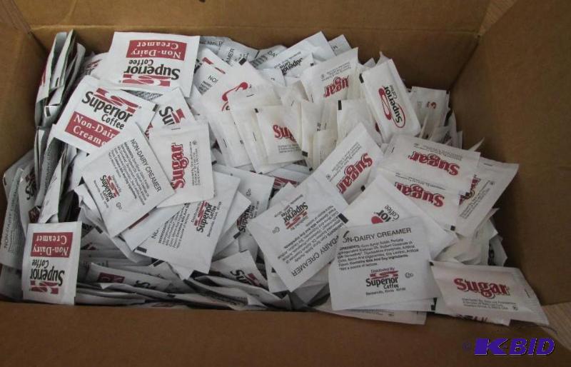 Box approx half full of creamer and other hal...