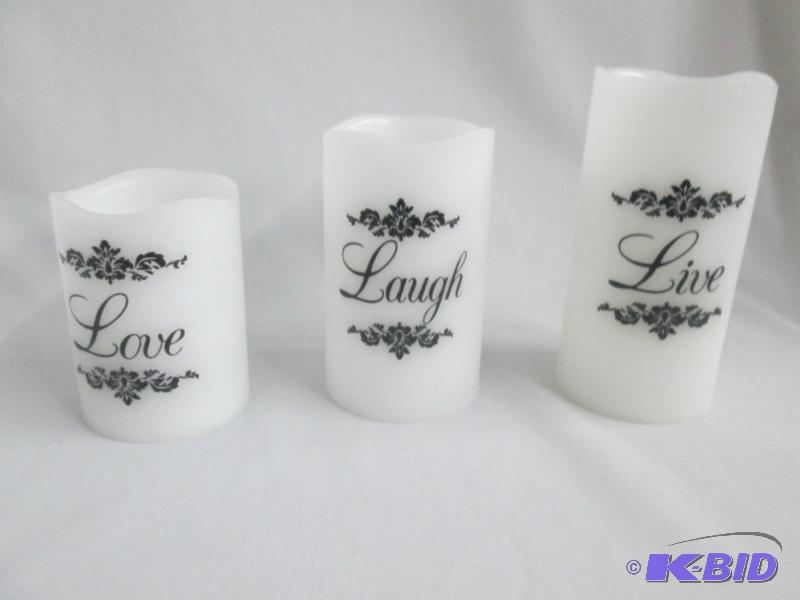 lot 44 image: 3-pc. Color-Changing Live Laugh Love Candle Set