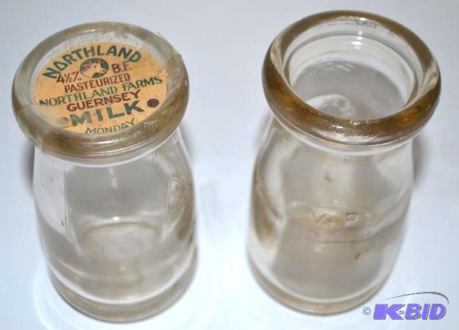 lot 116 image: Vintage glass milk bottles from Northland Far...