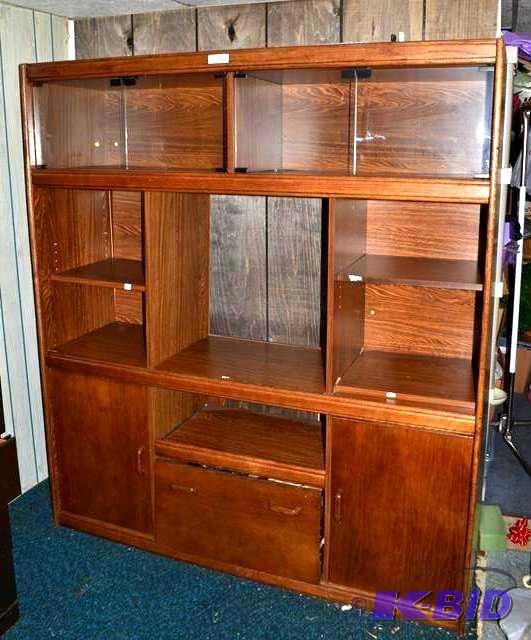 lot 122 image: Nice Wood entertainment center with glass doo...