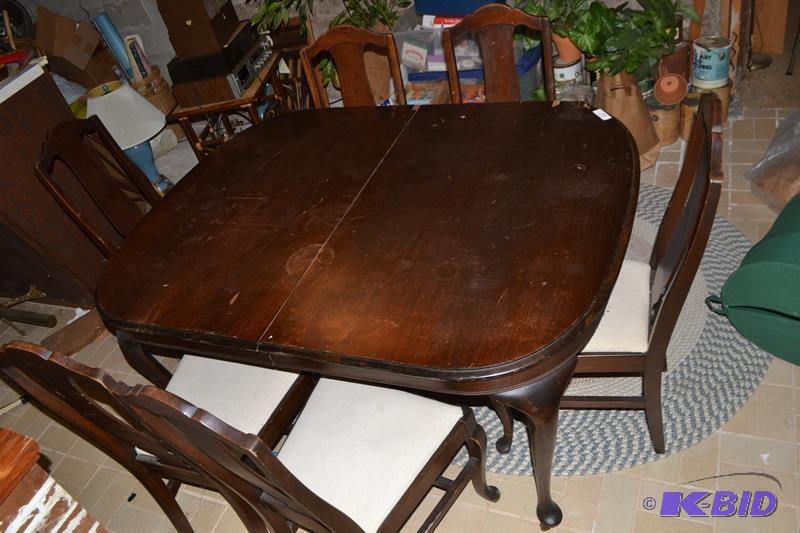 lot 60 image: Antique table & 6 chairs wood wheelscast...