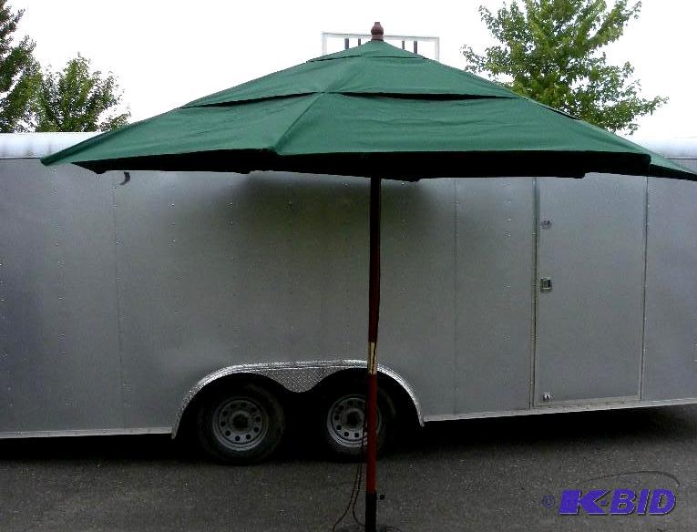 lot 25 image: 11 foot 3 Tier Umbrella, Hunter Green, 3 sect...