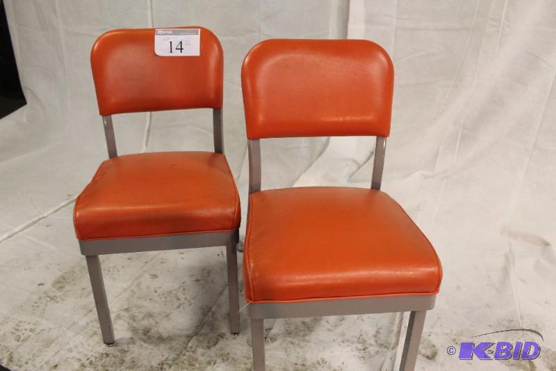 Set of two chairs. Steel frames with orange p...
