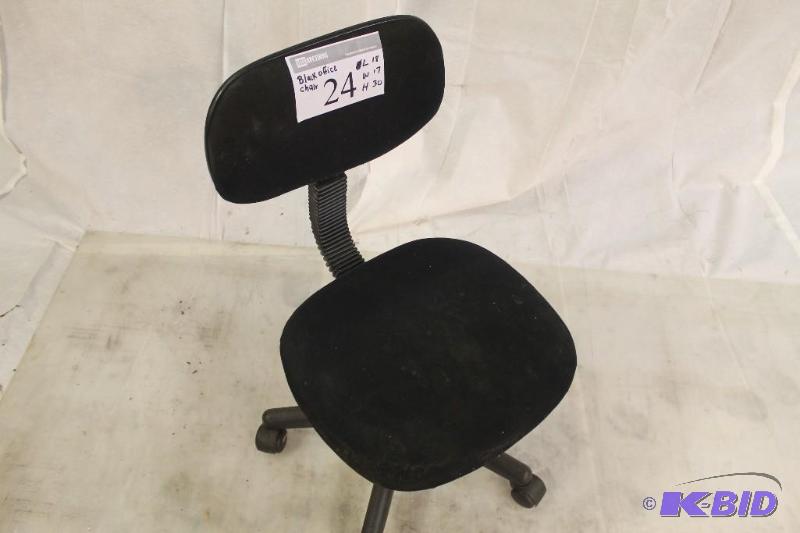Typing or desk chair. Plastic covering on met...