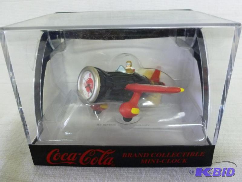 lot 144 image: Coca-Cola collectible airplane mini-clock, ne...