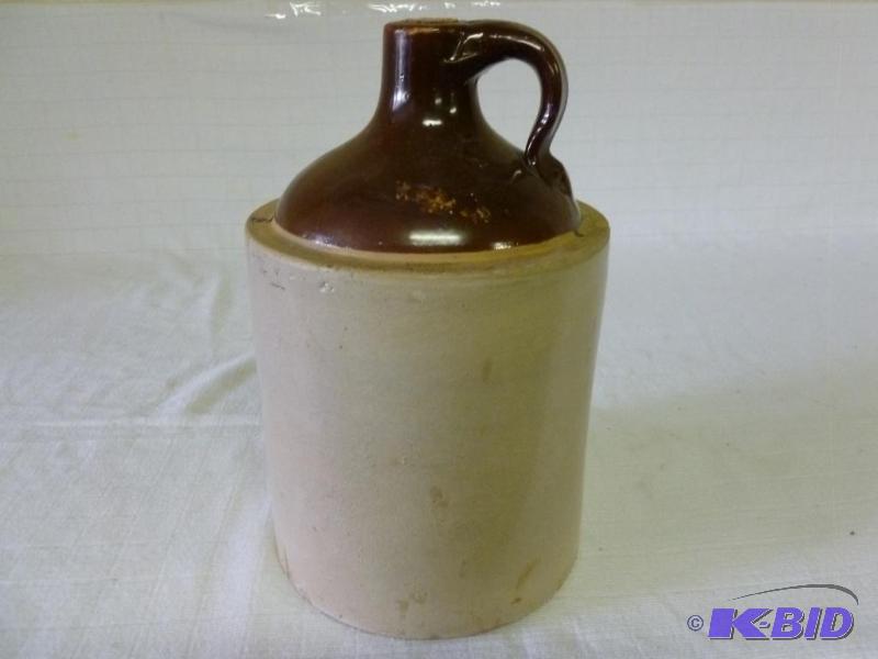 lot 152 image: Antique brown top crock jug that measures 7 1...