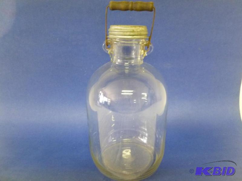lot 158 image: Large vintage one gallon embossed glass jug w...
