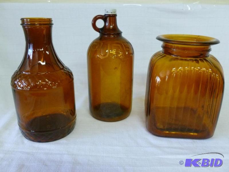 lot 176 image: Lot of three large vintage amber glass contai...
