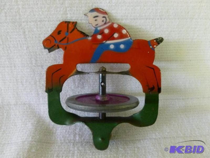 lot 18 image: Vintage jockey and horse metal track toy....
