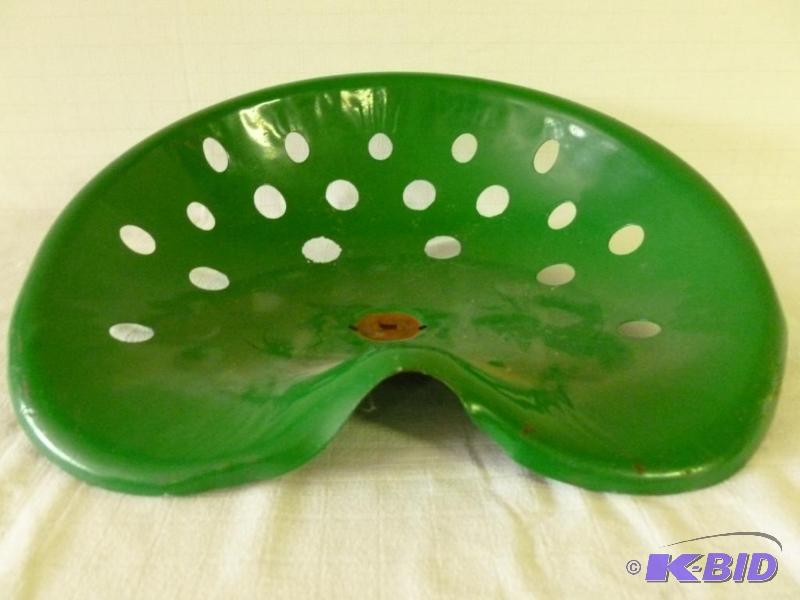 lot 19 image: Large vintage metal tractor seat that measure...
