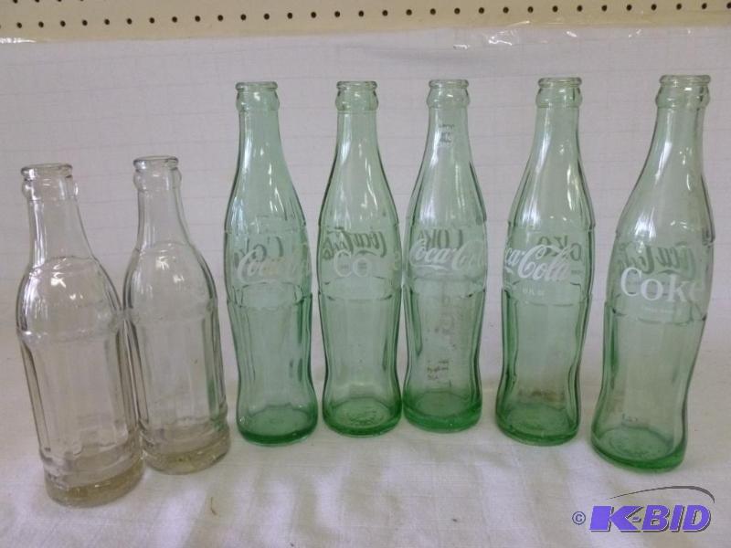 lot 204 image: Lot of seven vintage Coca-Cola glass soda bot...