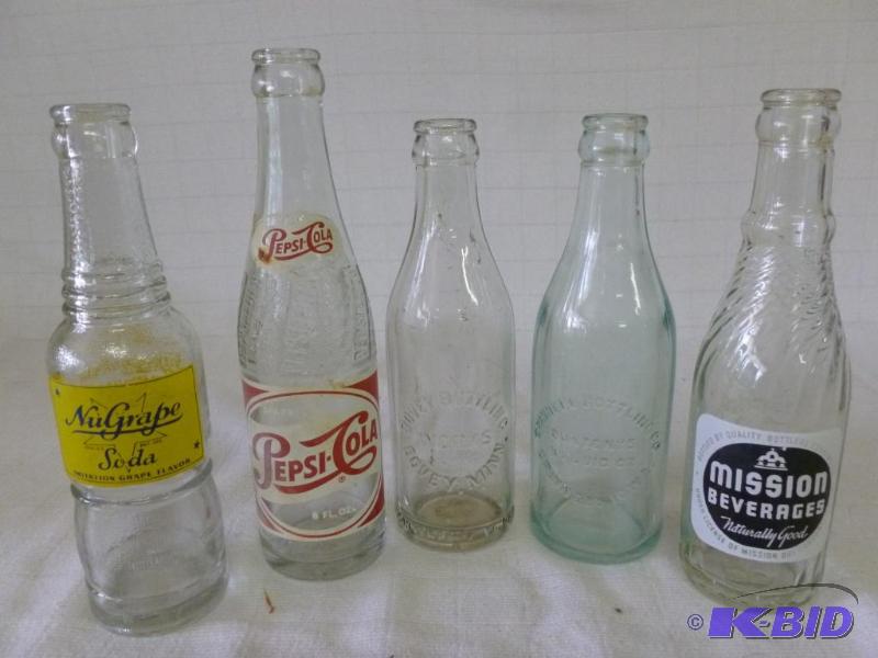 lot 206 image: Lot of five mixed vintage glass soda bottles....