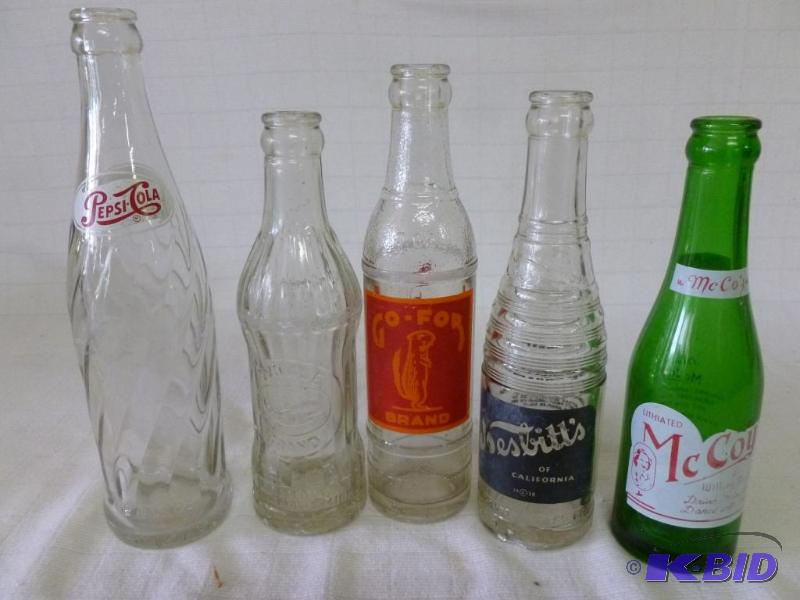 lot 207 image: Lot of five mixed vintage glass soda bottles....