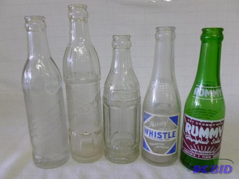 lot 208 image: Lot of five mixed vintage glass soda bottles....