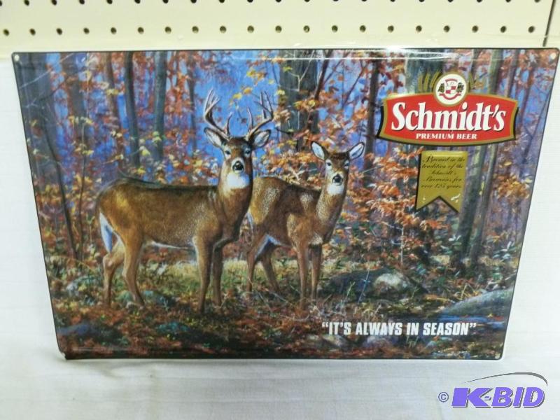 lot 25 image: Schmidts embossed metal beer sign that measu...