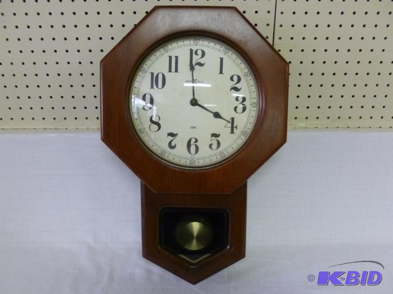 lot 38 image: Large Howard Miller Clock Company wood encase...