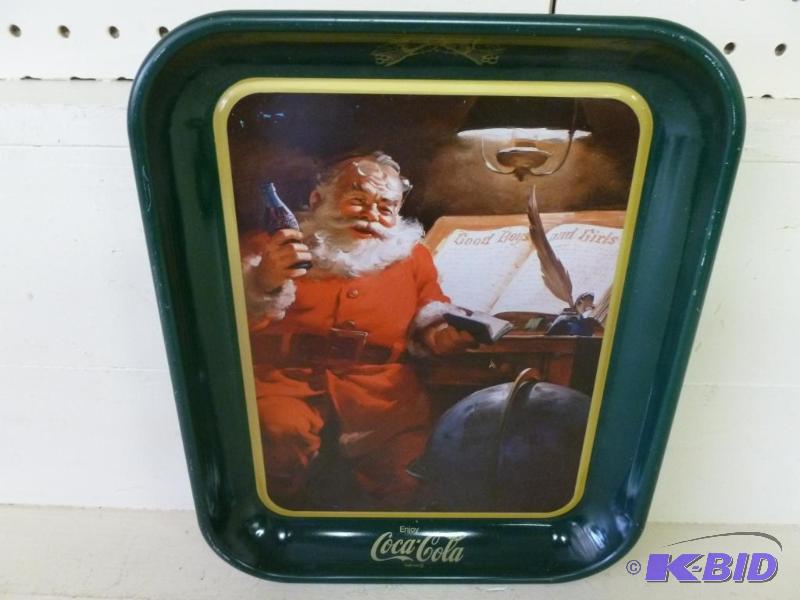 lot 64 image: Collectible 1983 Coca-Cola Santa metal servin...