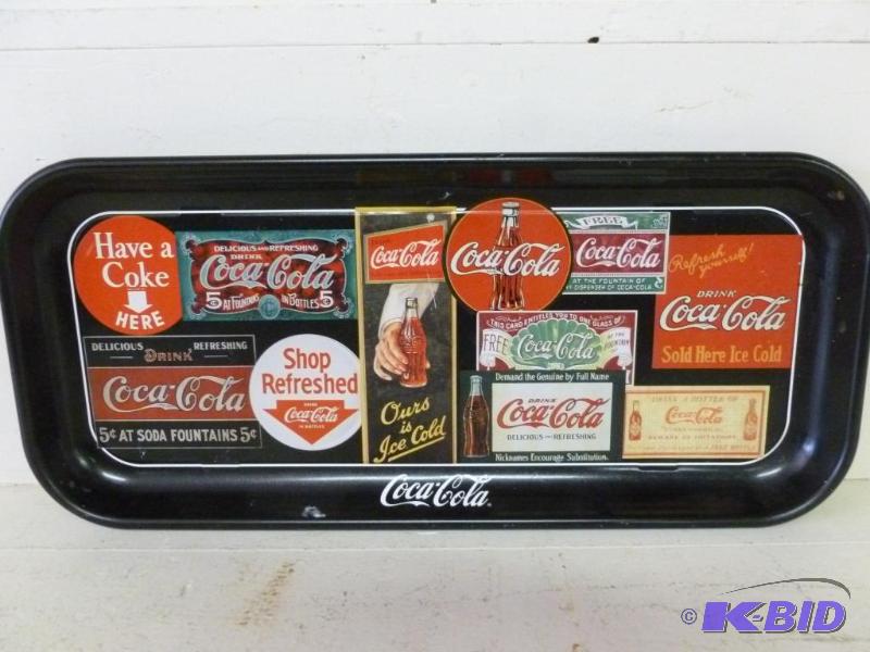 lot 69 image: Collectible Coca-Cola metal serving tray that...