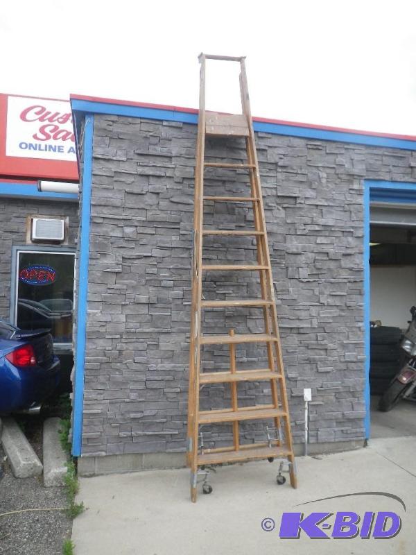 11 tall wooden step ladder, has wheels when ...