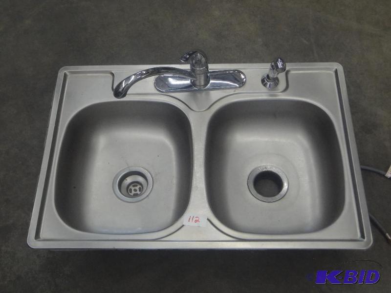 lot 112 image: Double Bowl Stainless Sink With Faucet...