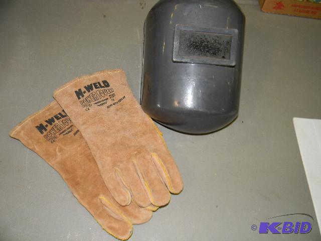 lot 60 image: Welding helmet and gloves - helmet needs wing...