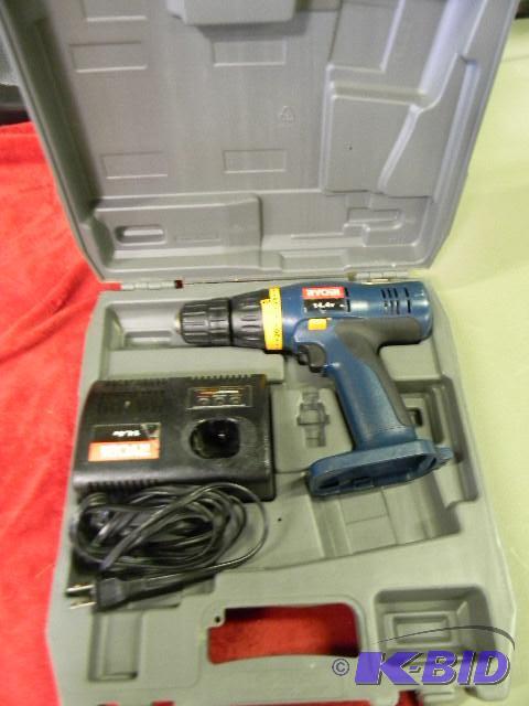 lot 73 image: Ryobi 14.4v drill with charger in grey case -...