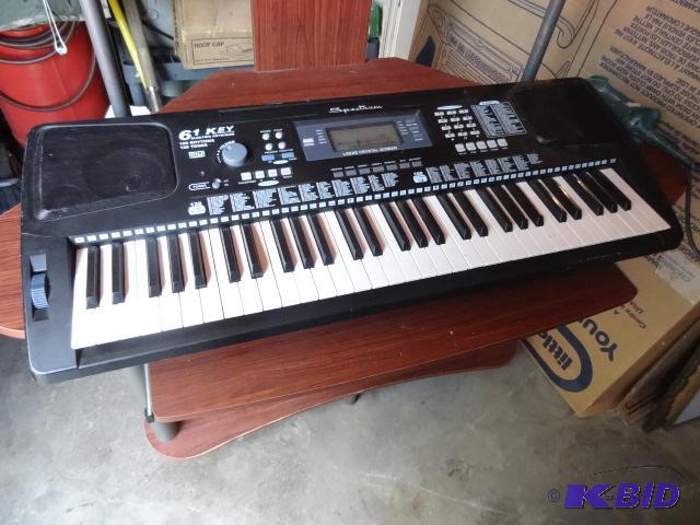 lot 52 image: Spectrum 61 Electric Keyboard. No Power Cord....