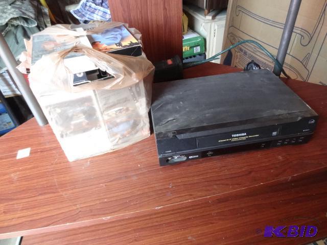 lot 62 image: Toshiba VCR W-522. Misc VHS tapes. Powers on...