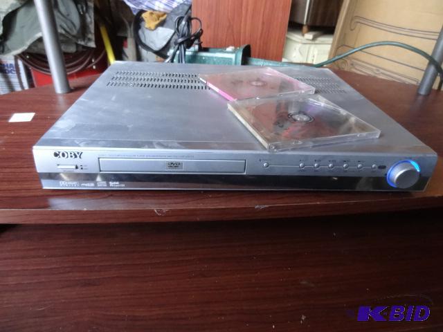 lot 63 image: 2 exercise DVDs. Coby DVD player. DVD915. Po...