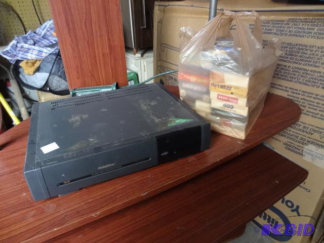 lot 65 image: Misc VHS tapes. Goldstar VHS player. Powers o...