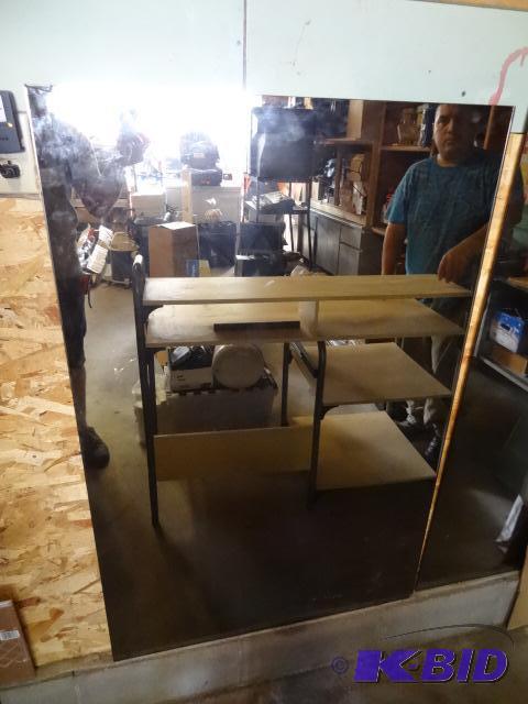 lot 69 image: 2 mirrors. 33 x 50. One has a chipped corner....