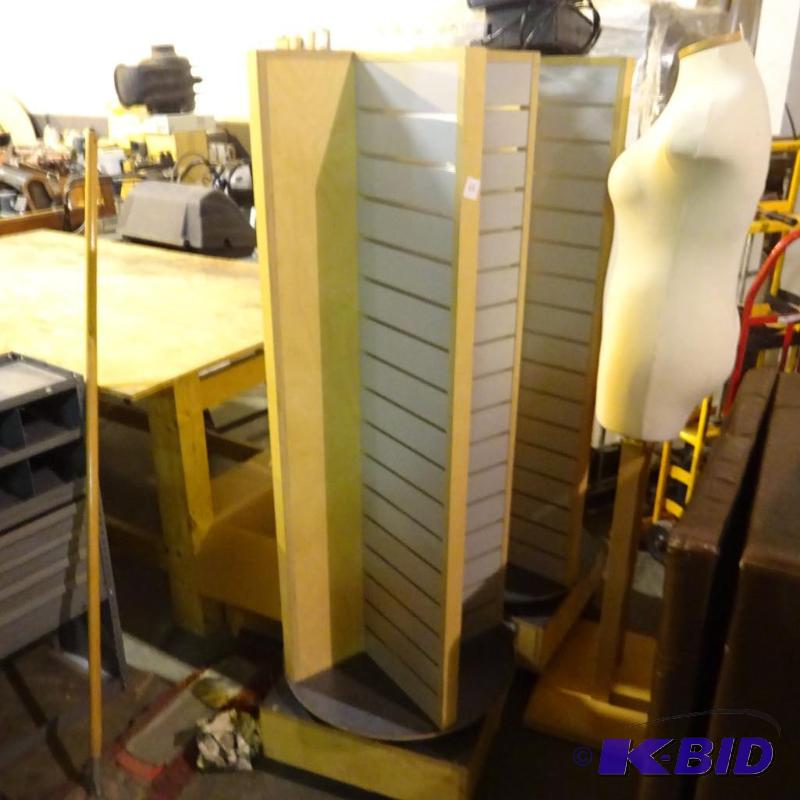 lot 67 image: Rotating slat wall display on wheels. 20 x 20...