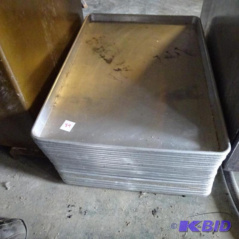 lot 89 image: 23 full size baking sheets...