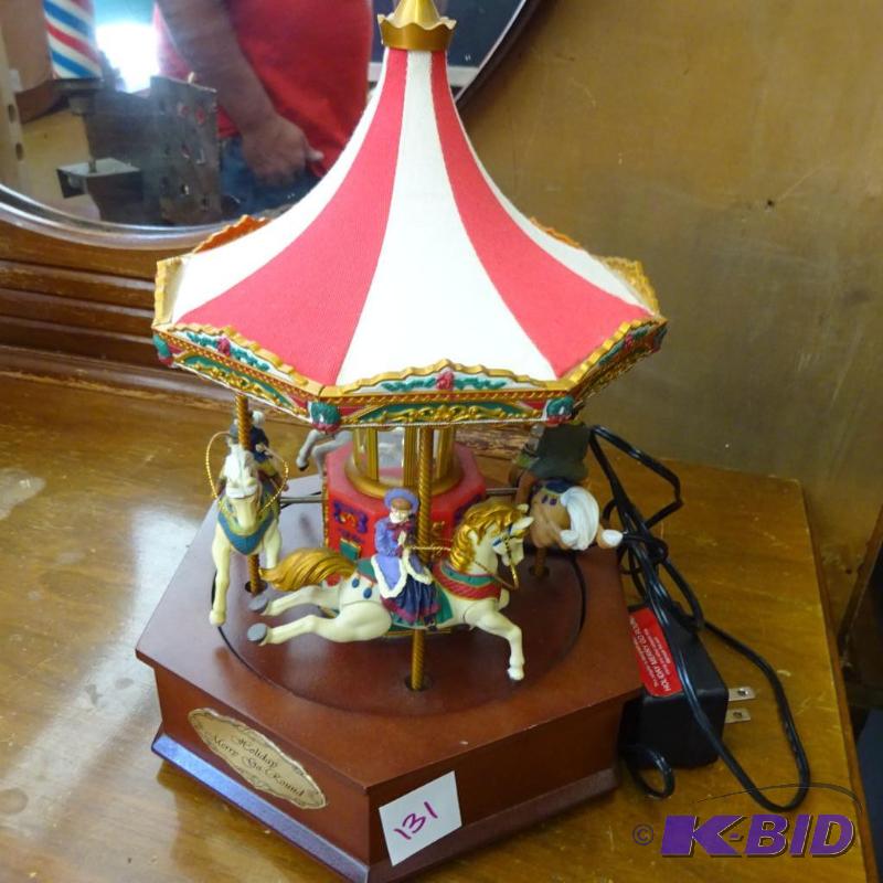 lot 131 image: Holiday merry go round....