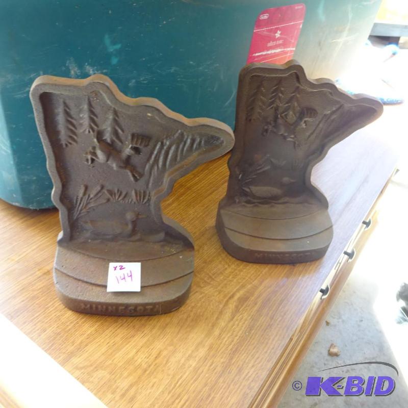 lot 144 image: 2 Minnesota cast iron Book ends...